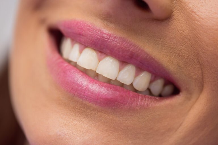 Close-up of female patient receiving a dental treatment at clinic