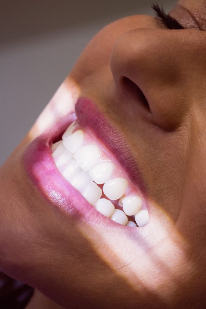 Close-up of female patient receiving a dental treatment at clinic